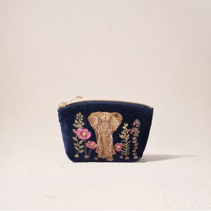 Navy blue pouch with embroidered elephant and flowers on a light beige background
