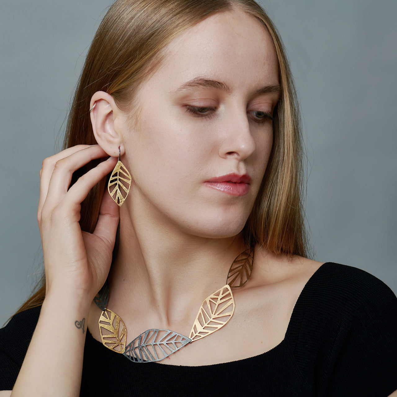 echo_deco_oxidised_sterling_silver_and_gold_geometric_leaf_necklace_and_earrings