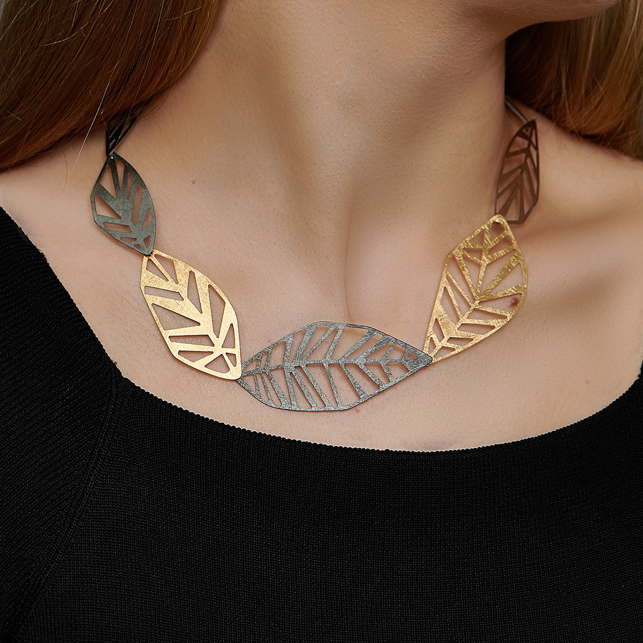 echo_deco_oxidised_sterling_silver_and_gold_geometric_leaf_necklace