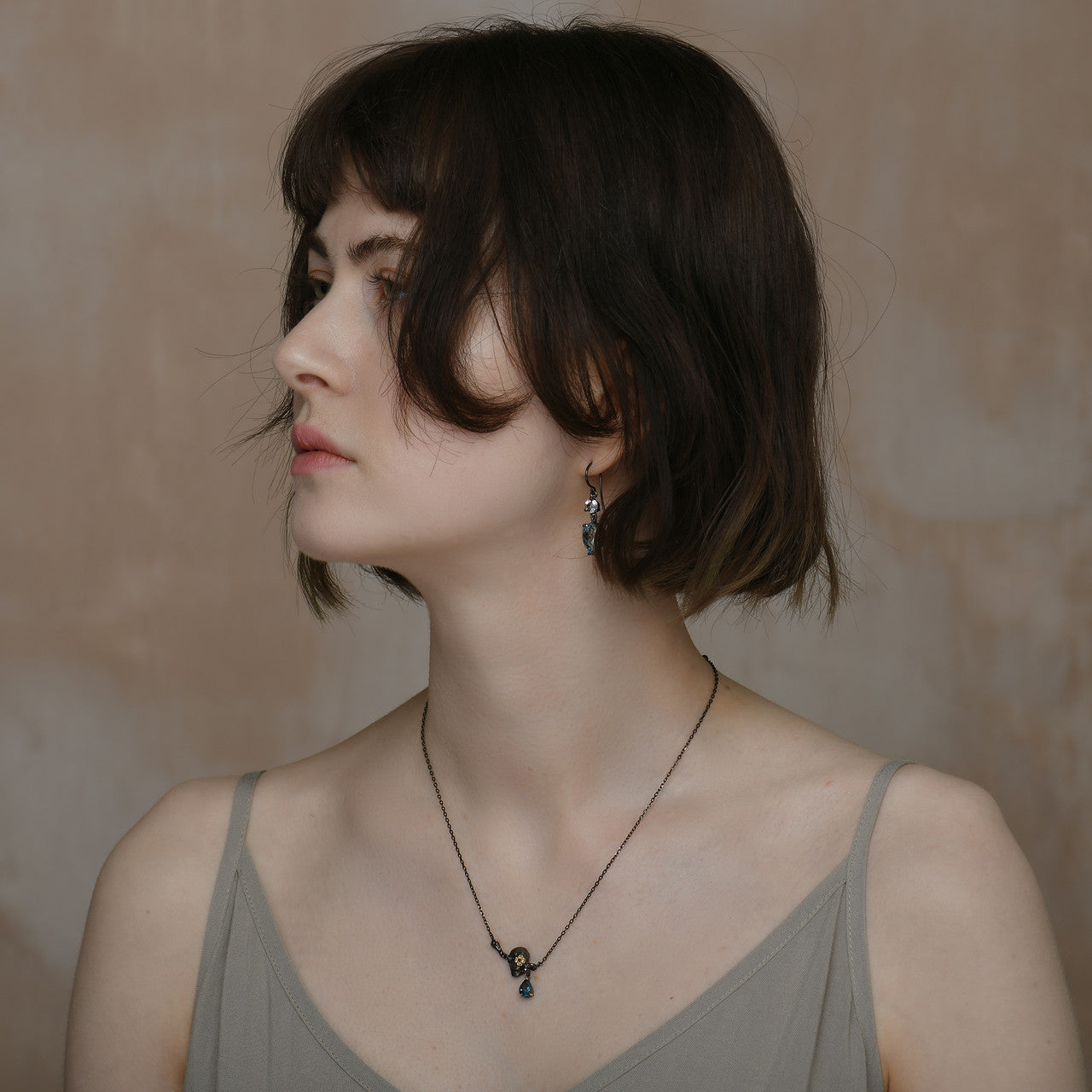 janus_oxidised_sterling_silver_gold_plating_blue_topaz_skull_muerto_necklace