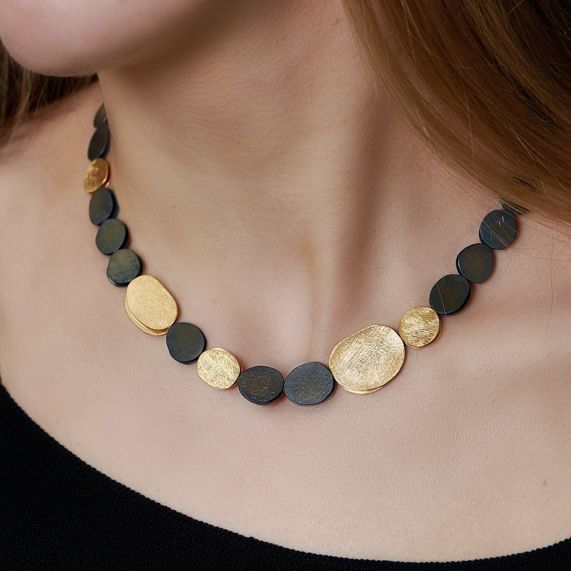 Deco Echo - Black And Gold Pebble Necklace